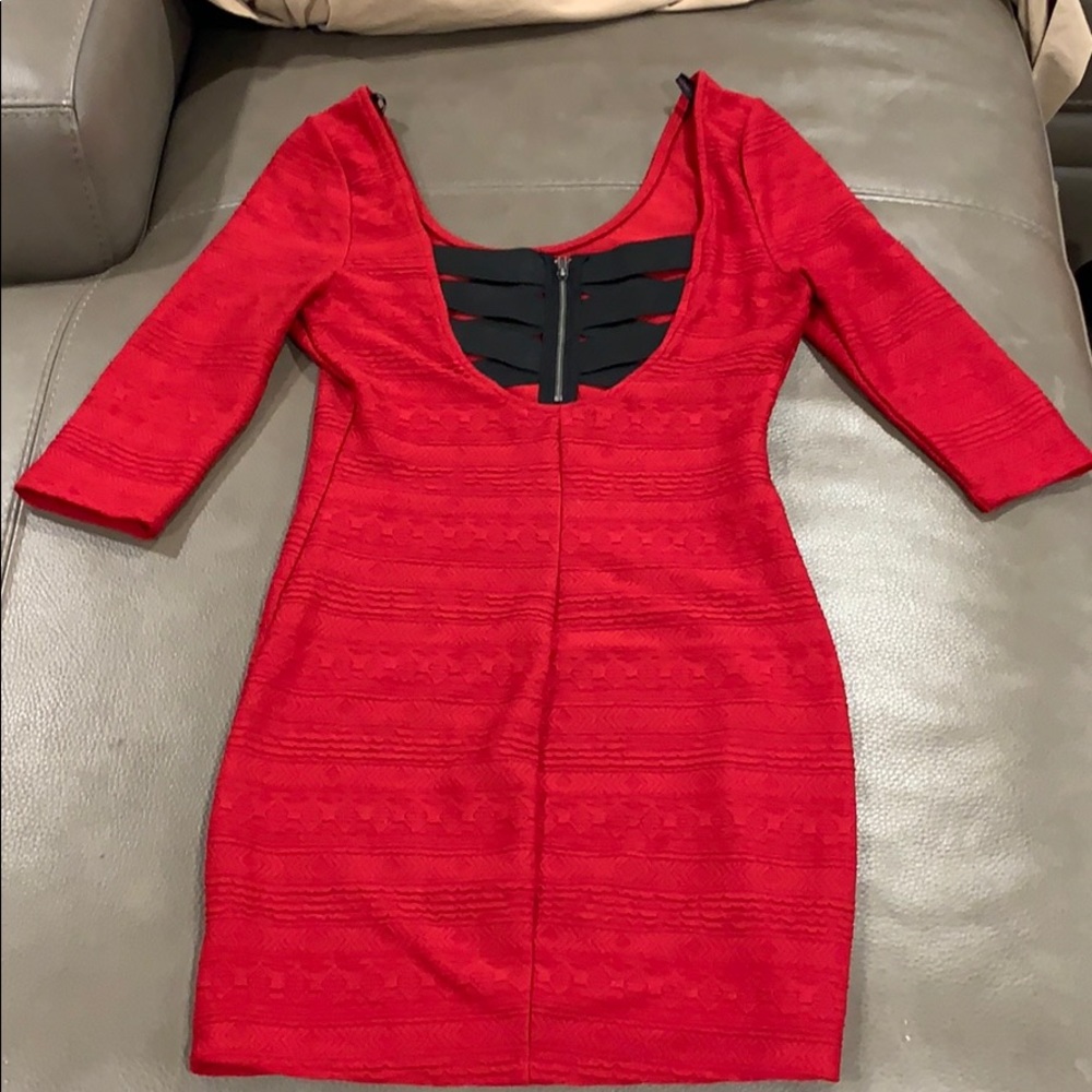Small red body con 3/4 sleeved dress